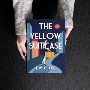 Woman holding yellow suitcase book